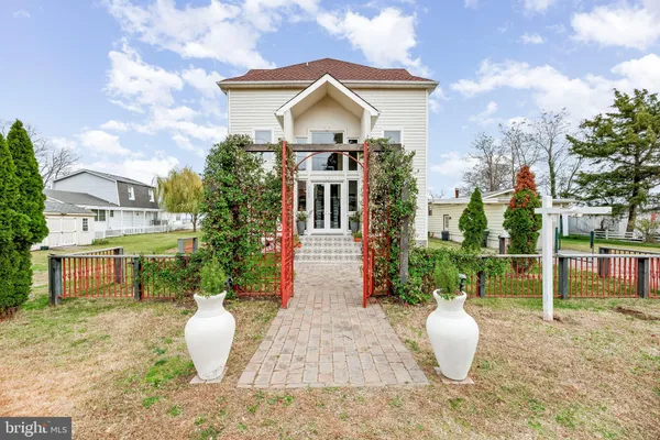 a kitchen with stainless steel appliances granite countertop a stove a sink and a white cabinets