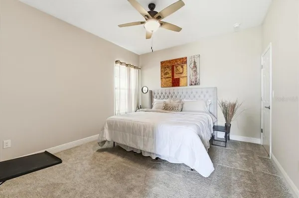 a bedroom with a bed and window