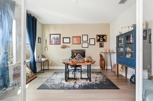 a living room with furniture and a rug