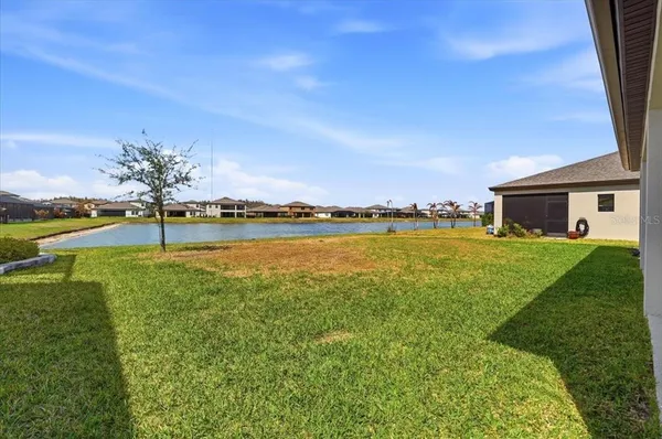 a view of a house with a big yard