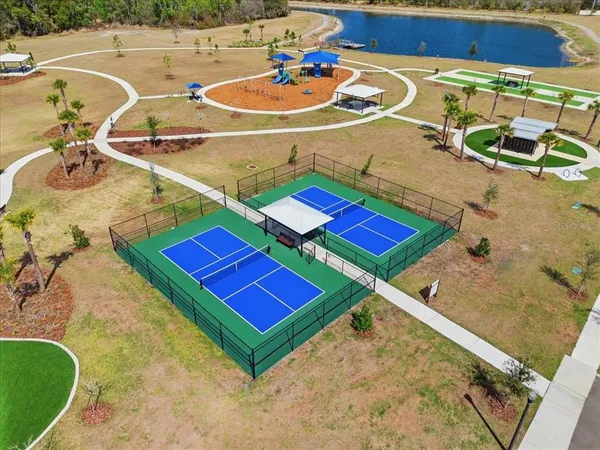 a view of an outdoor space and tennis court