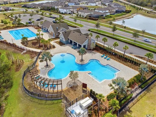 a view of a swimming pool with a table and chairs