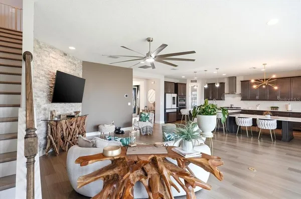 a living room with fireplace furniture and a flat screen tv
