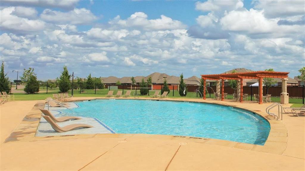 2714 Kirkhill Lane Forney, TX 75126 - Photo 13 of 14 a view of swimming pool with outdoor seating and barbeque in the background