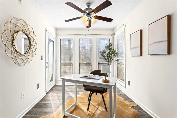 a very nice looking room with a large window and chandelier