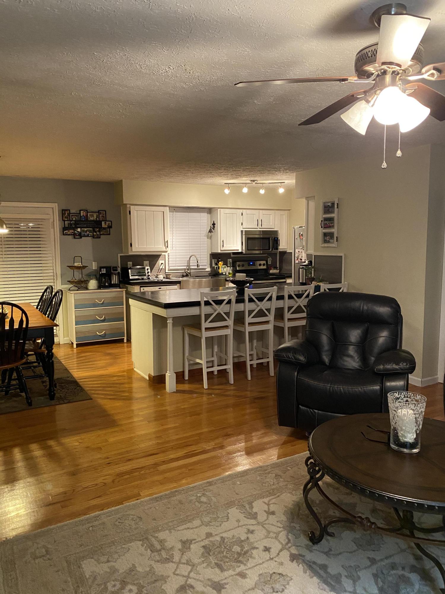 8757 Henry Road Henry, VA 24102 - Photo 11 of 21 a living room with stainless steel appliances furniture stove and kitchen view
