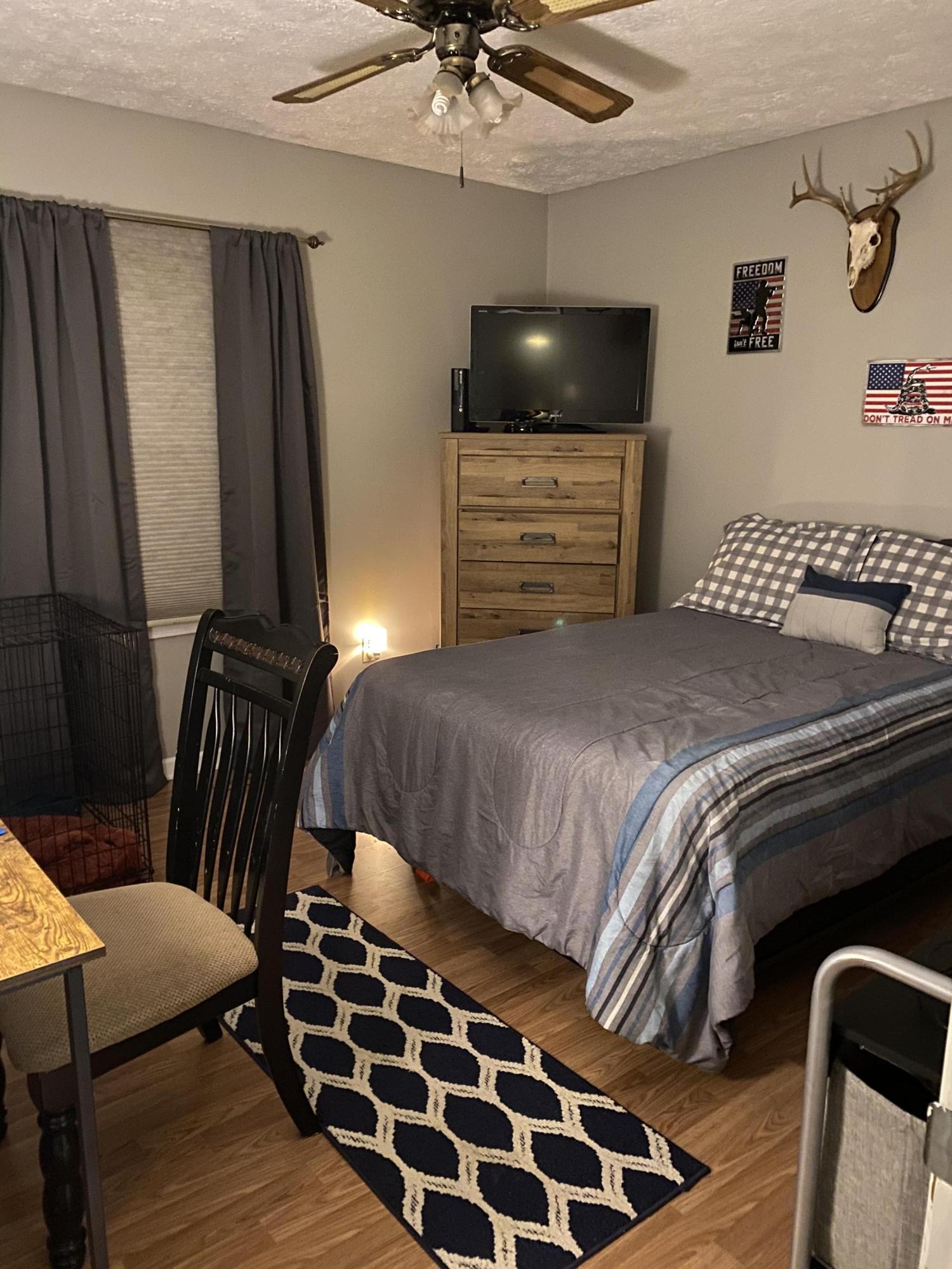 8757 Henry Road Henry, VA 24102 - Photo 13 of 21 a bedroom with a bed and a flat tv screen