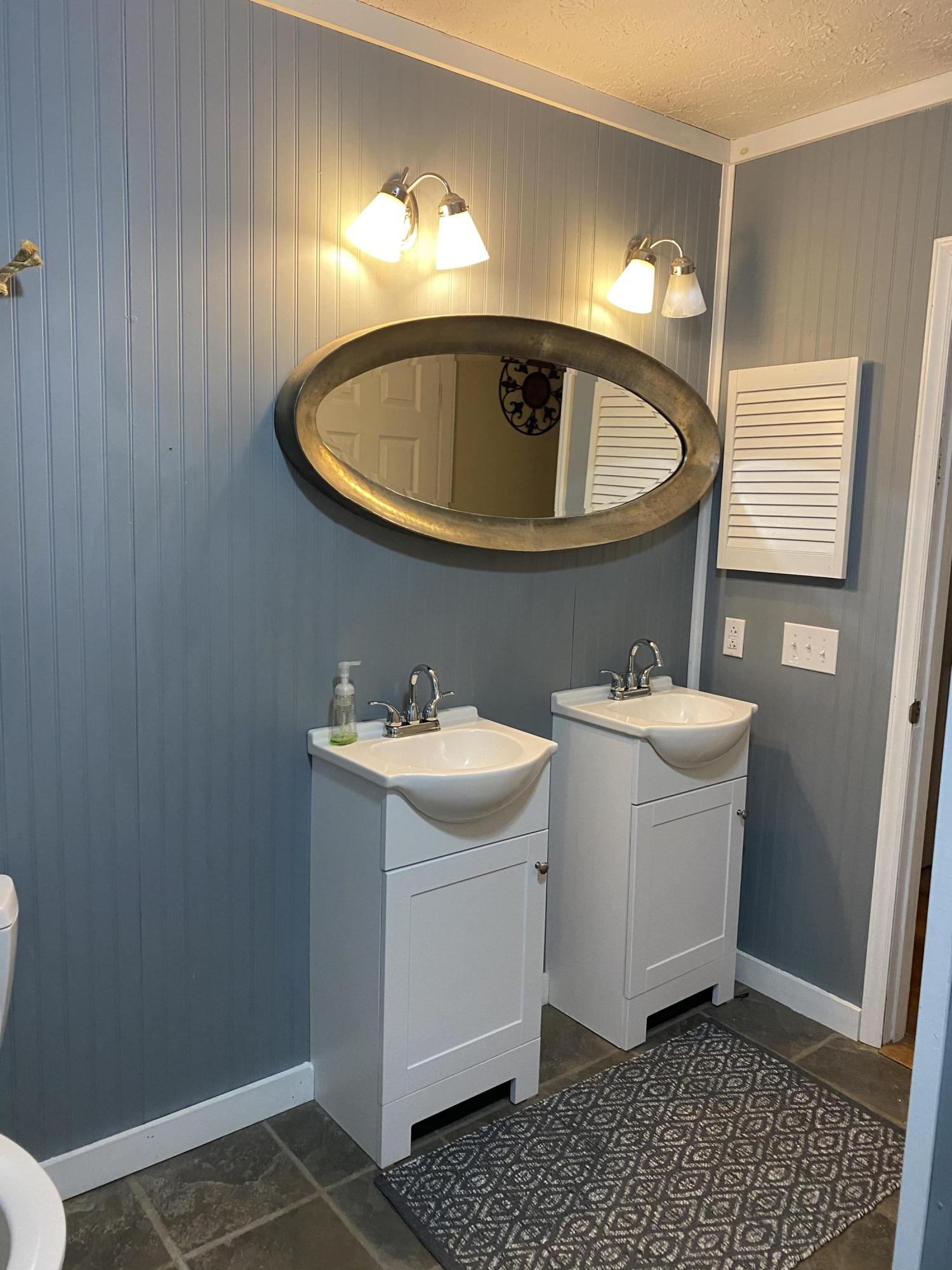 8757 Henry Road Henry, VA 24102 - Photo 14 of 21 a bathroom with a sink and mirror