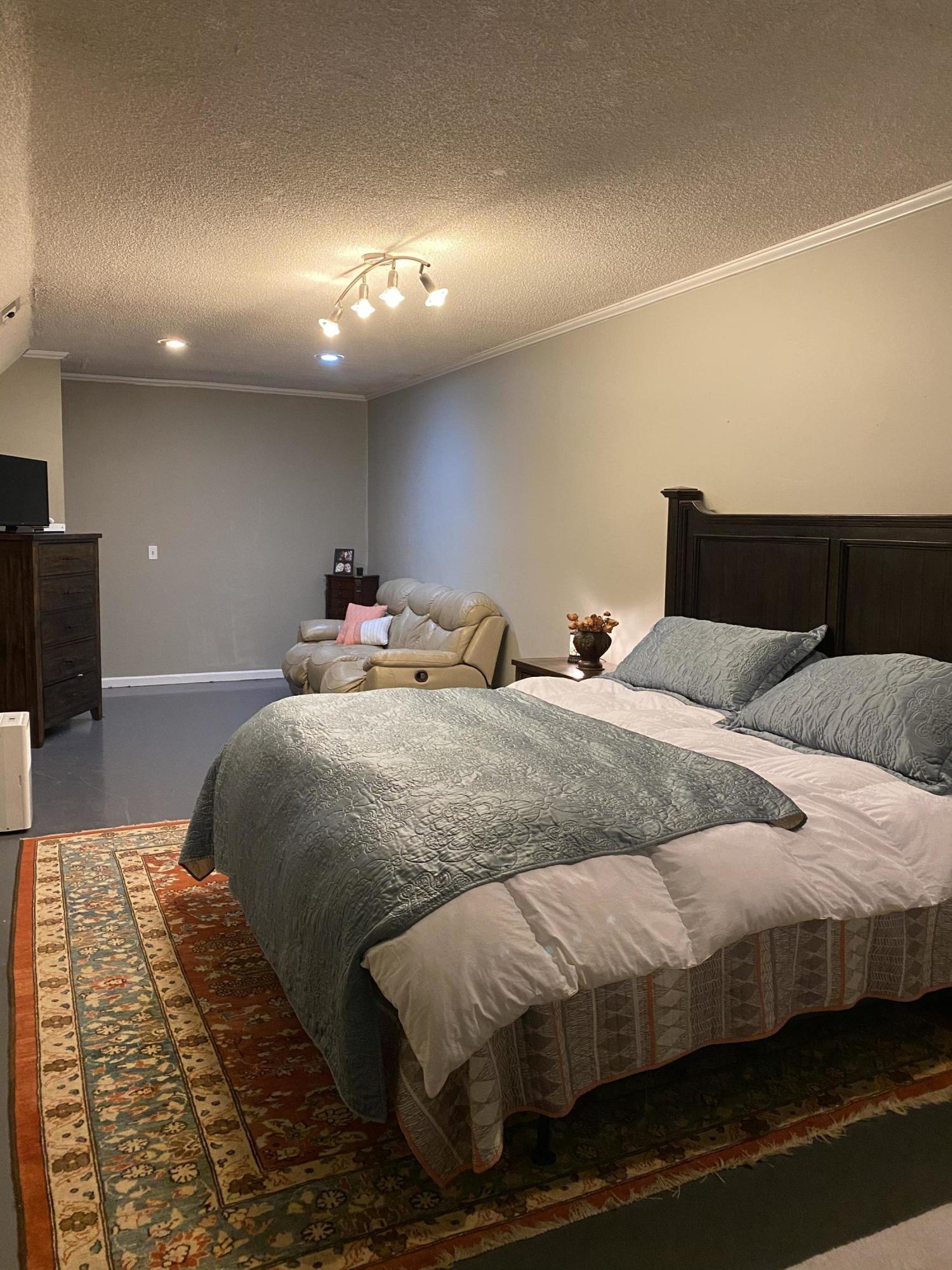 8757 Henry Road Henry, VA 24102 - Photo 19 of 21 a bedroom with a bed and a night stand