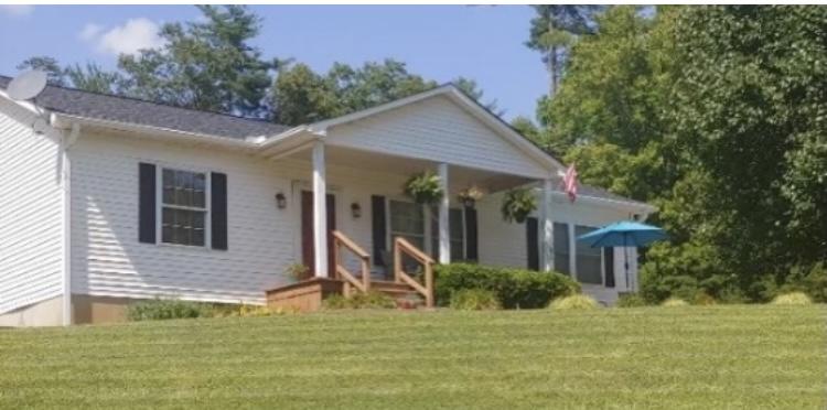 8757 Henry Road Henry, VA 24102 - Photo 4 of 21 a view of a house with a yard