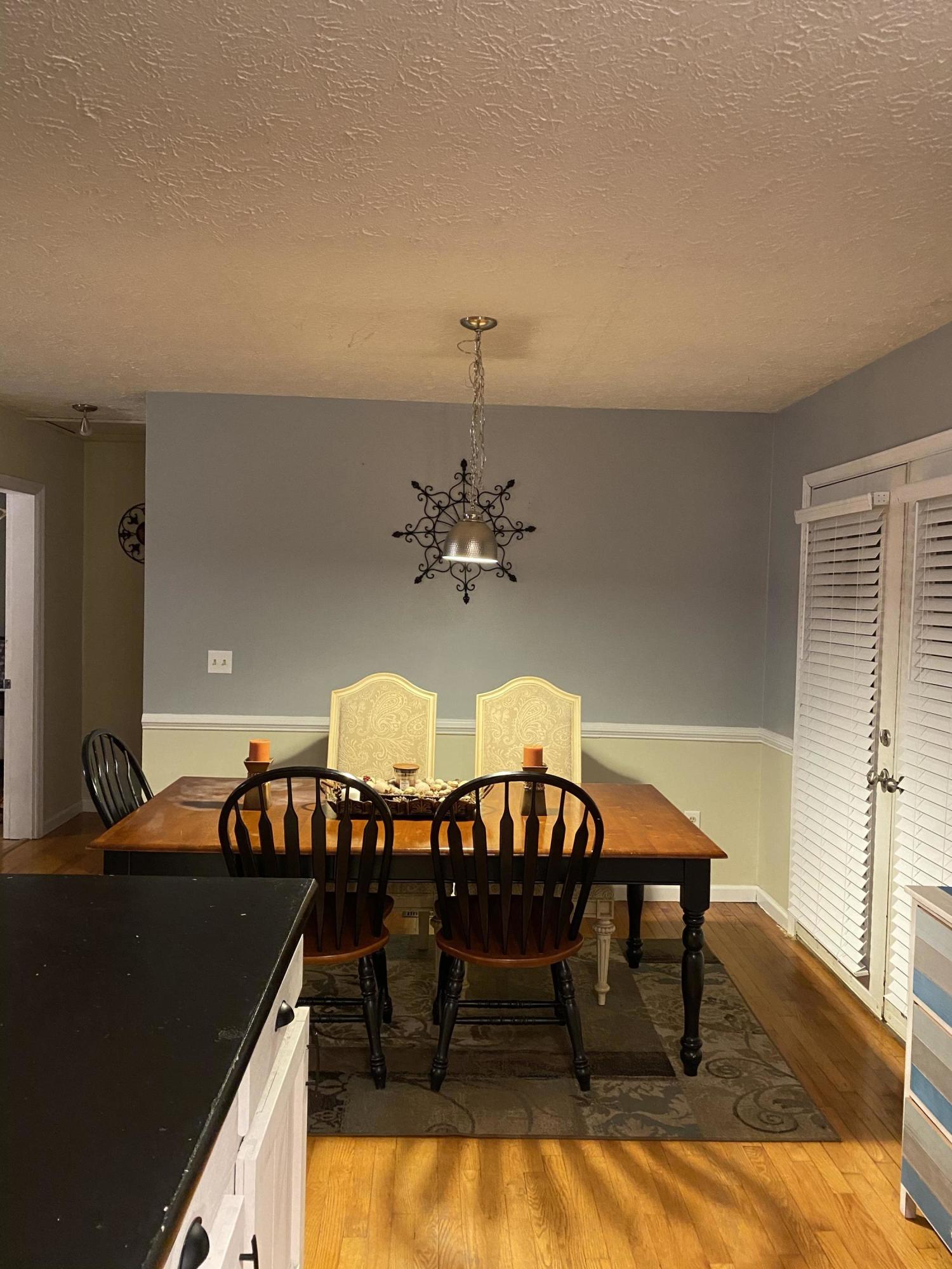 8757 Henry Road Henry, VA 24102 - Photo 9 of 21 a view of a dining room with furniture and chandelier