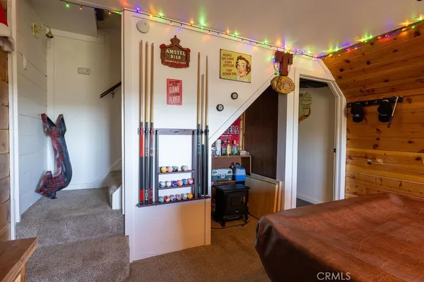a dining room with furniture and a flat screen tv