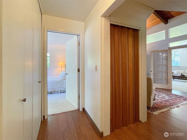 a view of a bathroom from a hallway