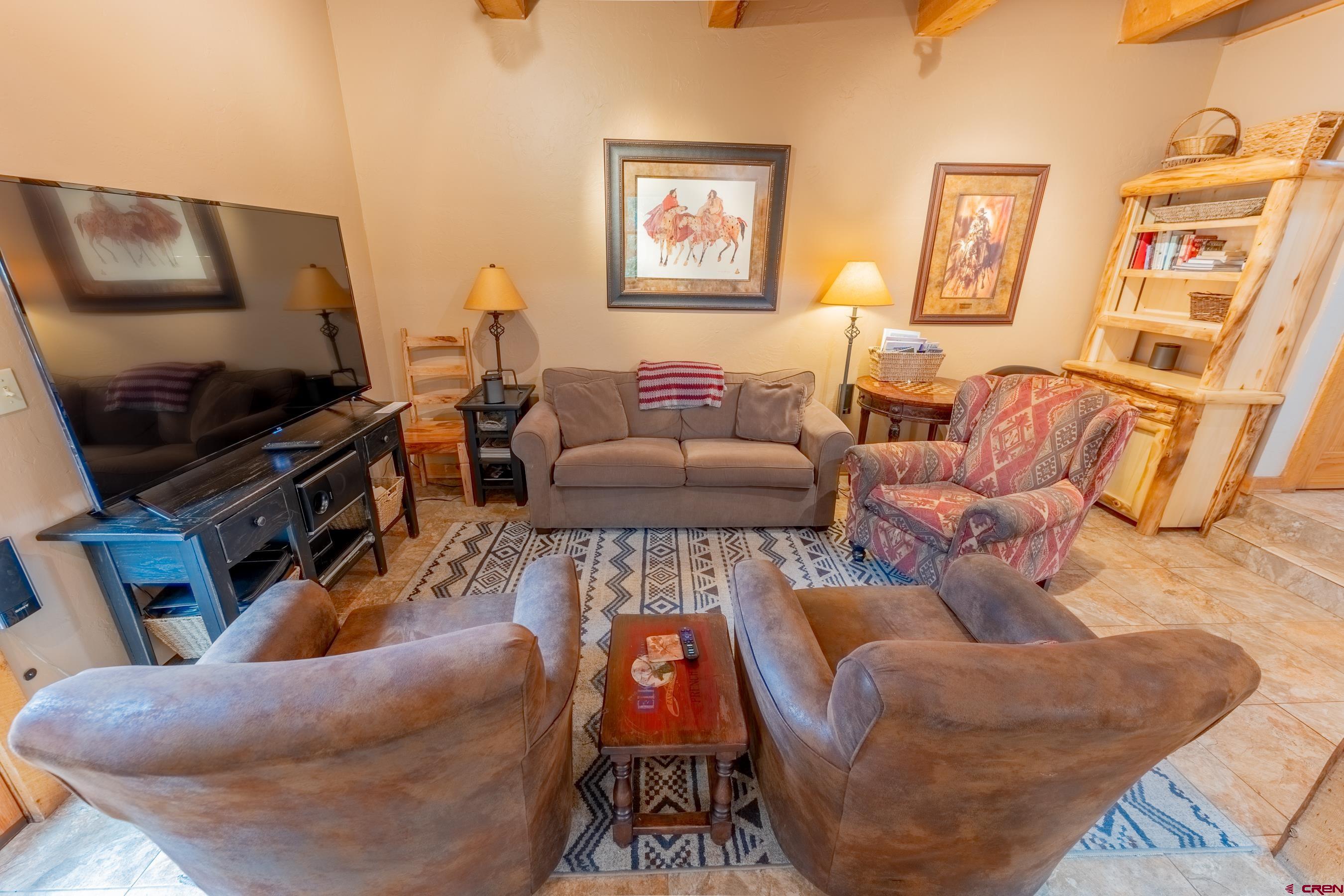 13 7th Street Crested Butte, CO 81224 - Photo 11 of 35 a living room with furniture and a flat screen tv