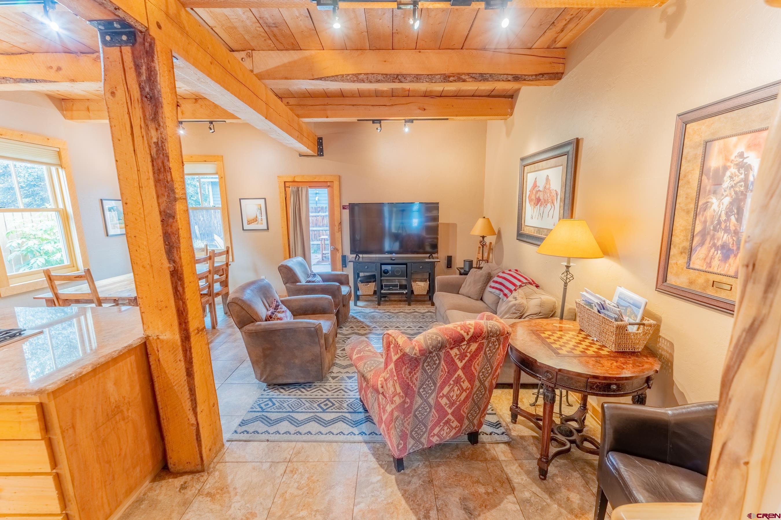 13 7th Street Crested Butte, CO 81224 - Photo 12 of 35 a living room with furniture and a flat screen tv