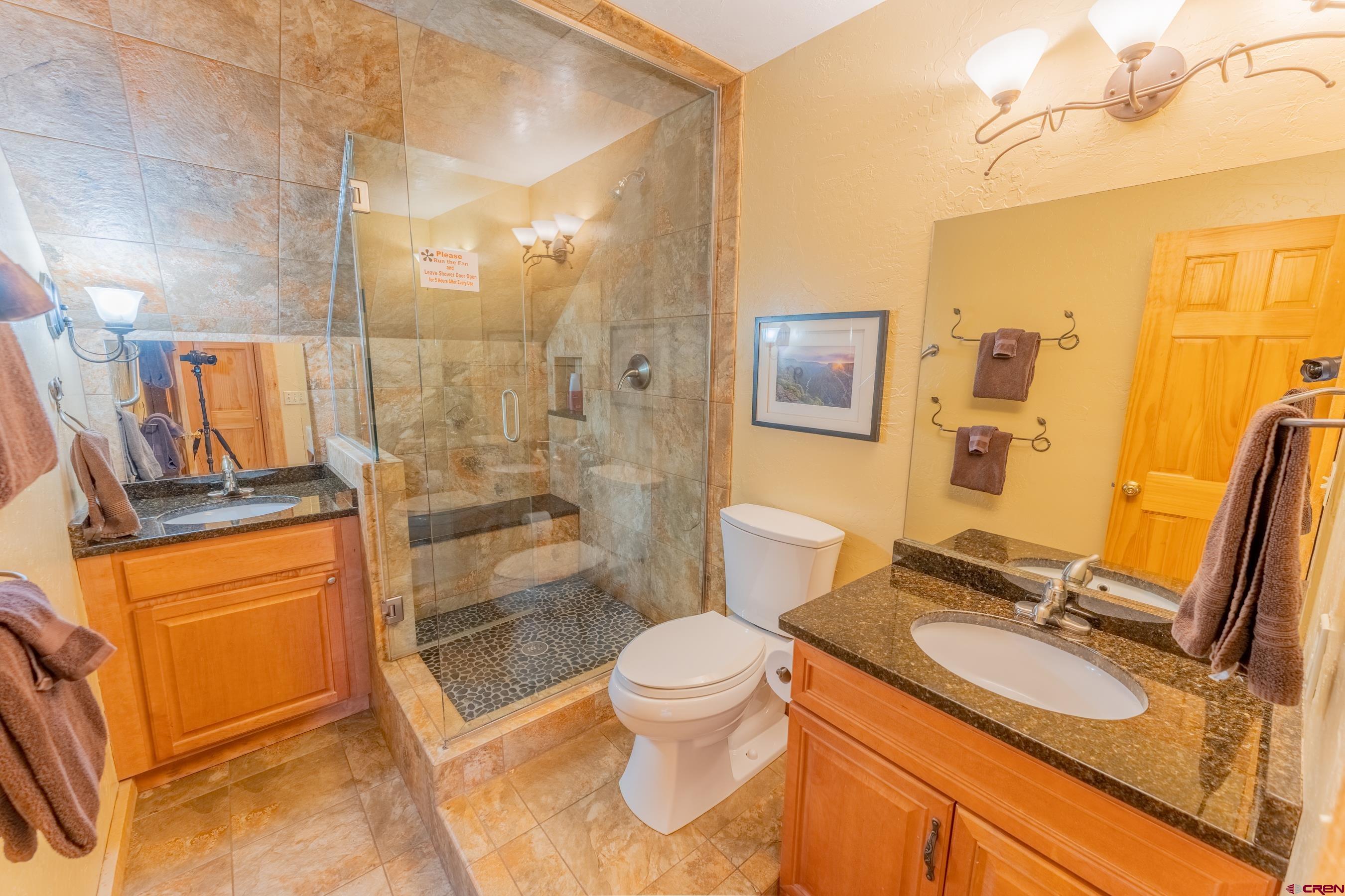 13 7th Street Crested Butte, CO 81224 - Photo 18 of 35 a bathroom with a sink a toilet and shower