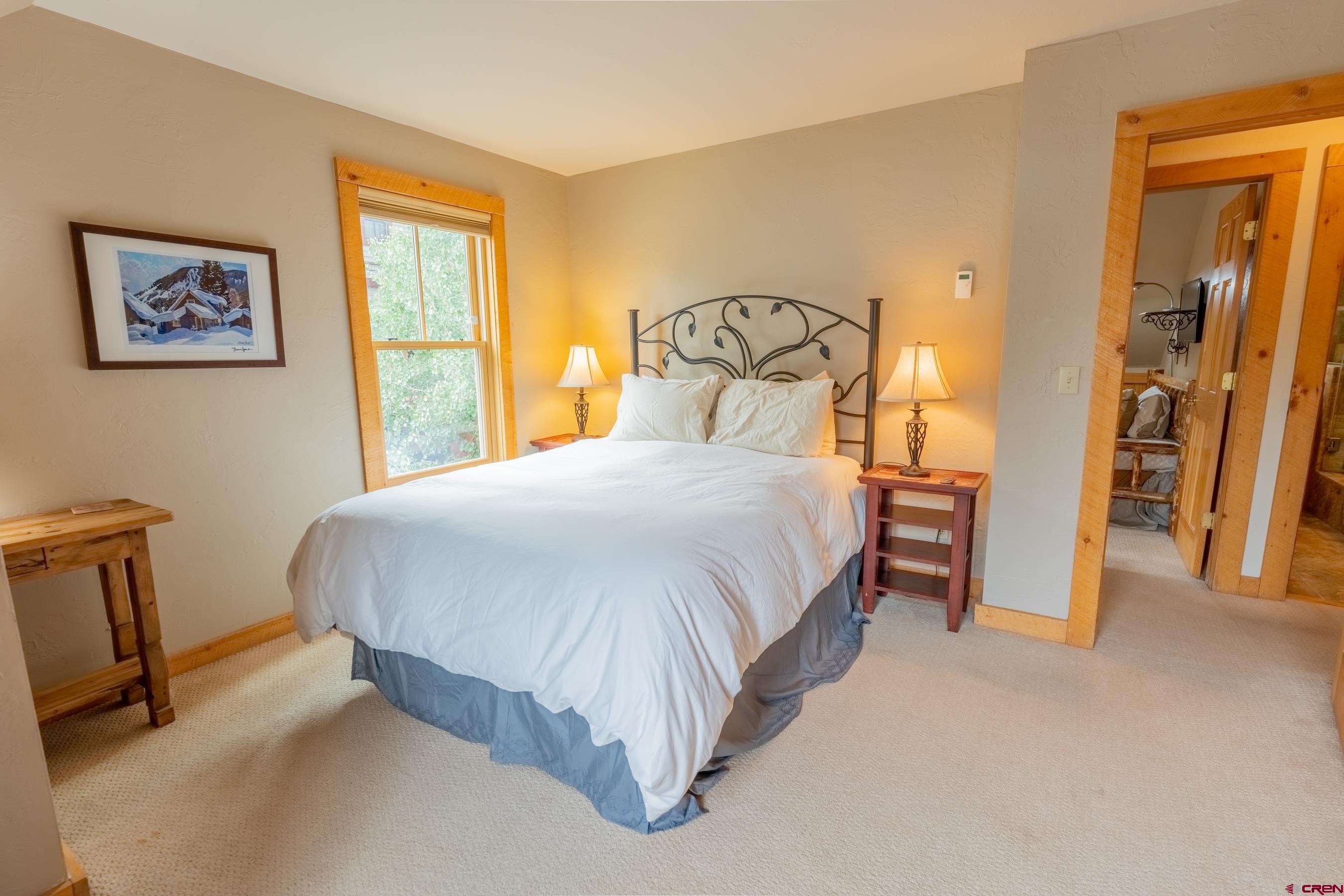 13 7th Street Crested Butte, CO 81224 - Photo 21 of 35 a bedroom with a bed and a desk