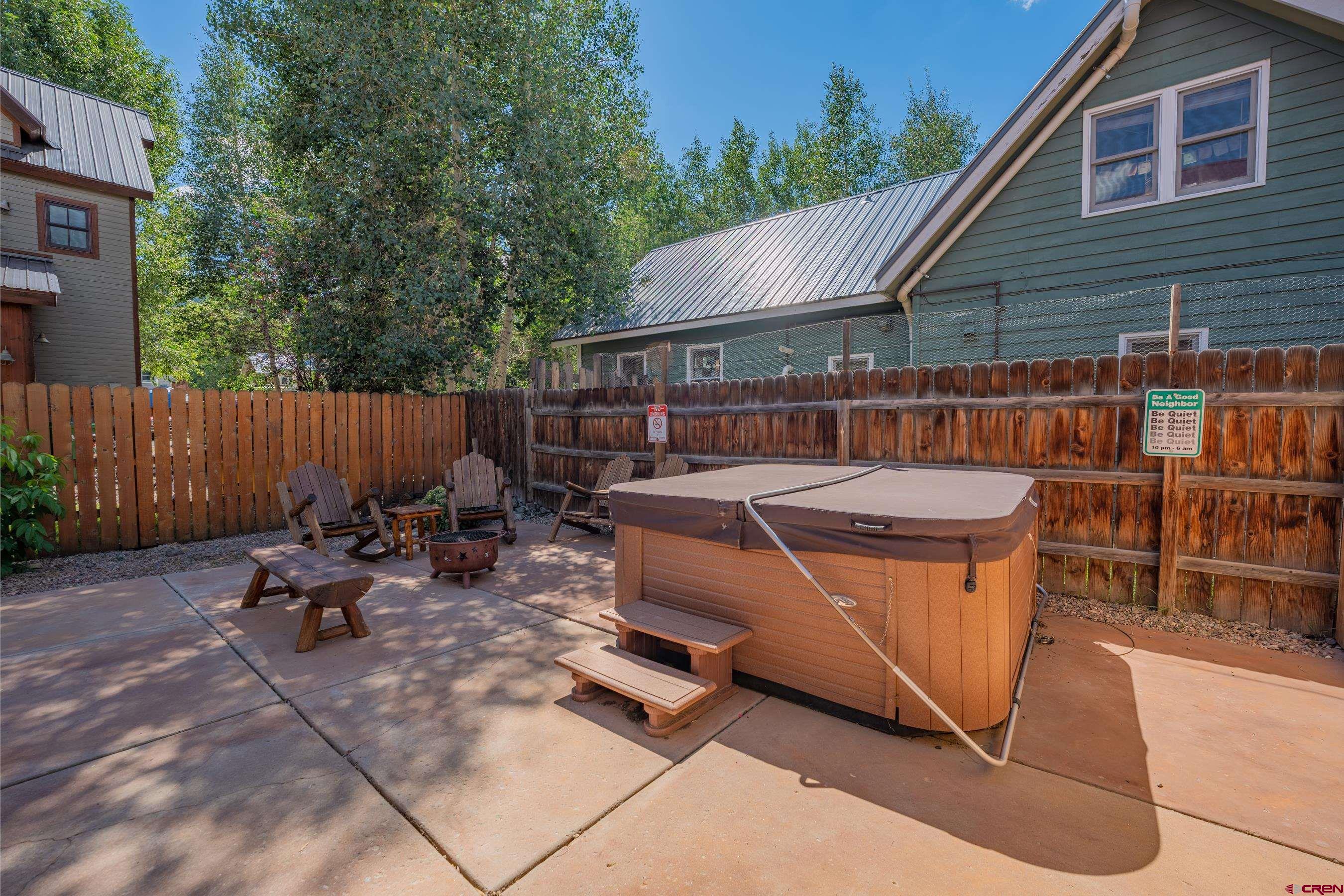 13 7th Street Crested Butte, CO 81224 - Photo 31 of 35 a backyard of a house with outdoor seating