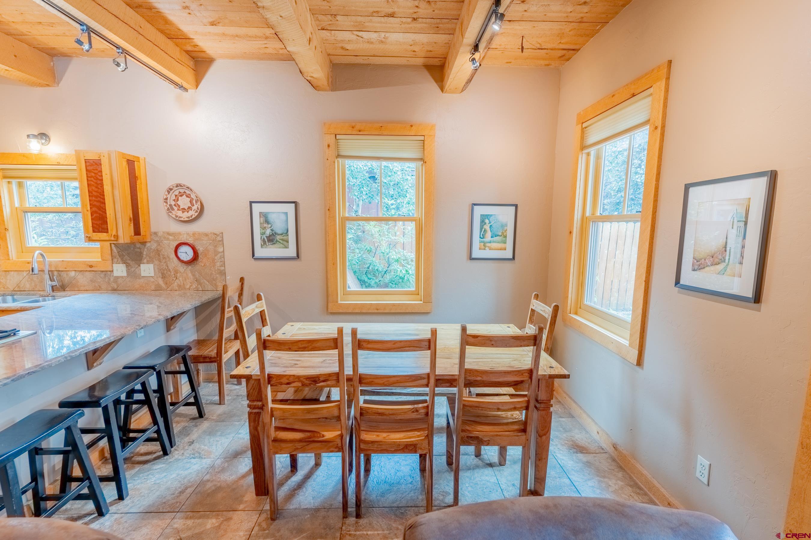 13 7th Street Crested Butte, CO 81224 - Photo 9 of 35 a dining room with furniture and window