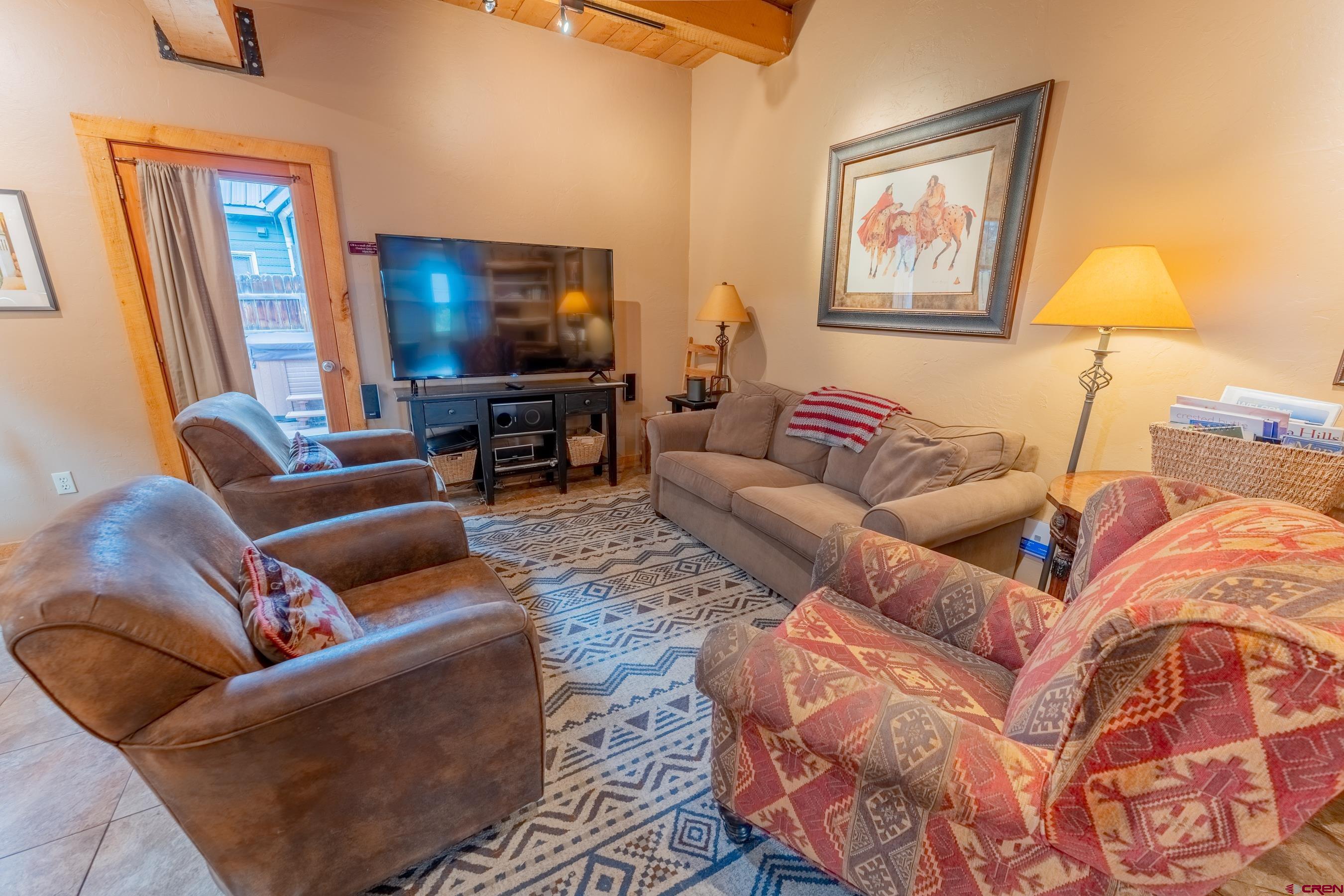 13 7th Street Crested Butte, CO 81224 - Photo 10 of 35 a living room with furniture and a flat screen tv