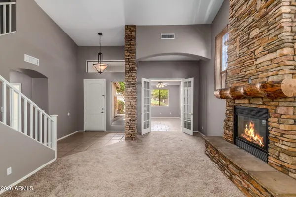 a view of an empty room with a fireplace
