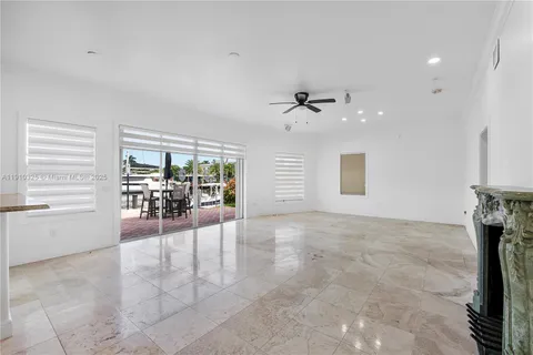 a kitchen with white cabinets stainless steel appliances and window