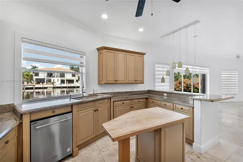 a bathroom with a tub a sink a mirror and a shower