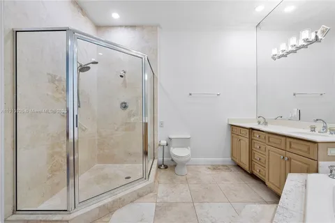 an empty room with fan and windows