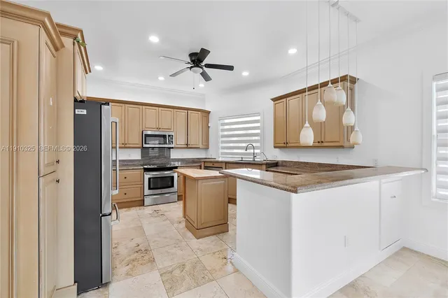a kitchen with stainless steel appliances granite countertop a refrigerator sink and cabinets