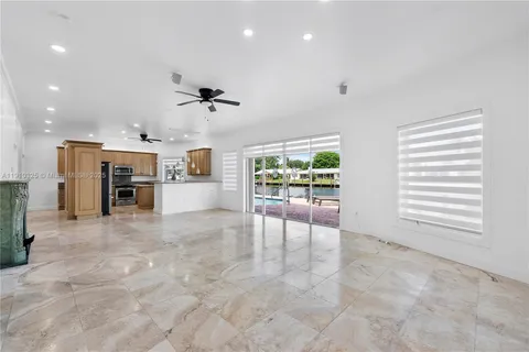 a view of room with a ceiling fan and window