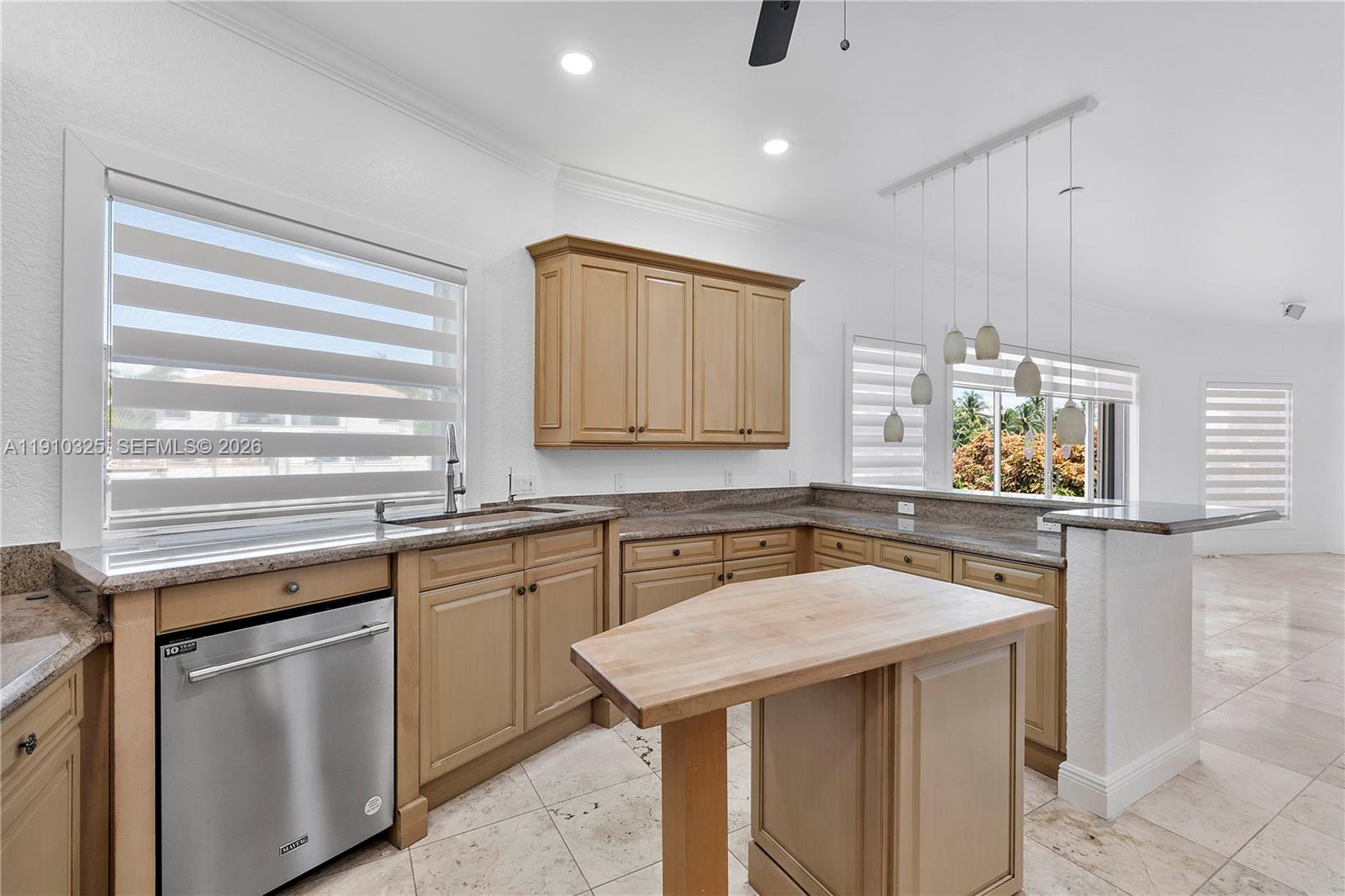 2737 Northeast 28th Court, Unit 1 Lighthouse Point, FL 33064 - Photo 29 of 46 a kitchen with a sink stove and cabinets