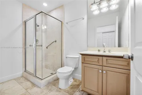 a view of a swimming pool and outdoor seating