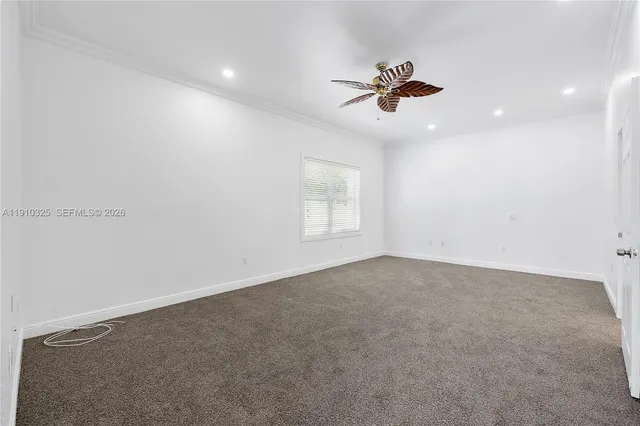 a view of storage and utility room with refrigerator