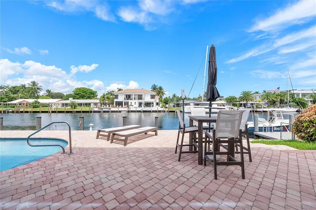 a view of a swimming pool with a lounge chair
