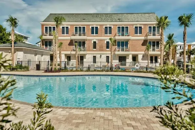 a front view of a building with garden