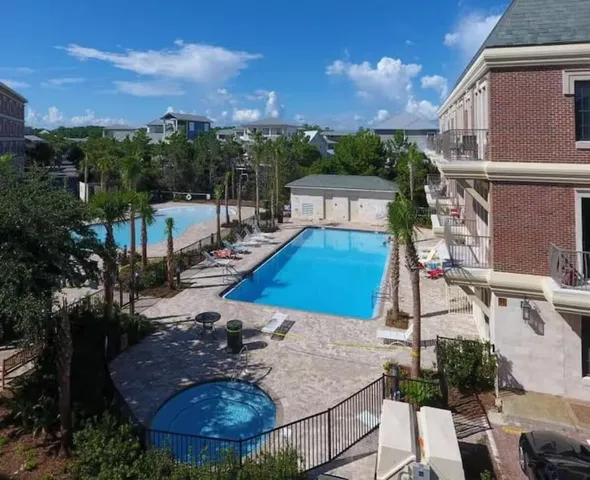 a view of a house with a yard and sitting area