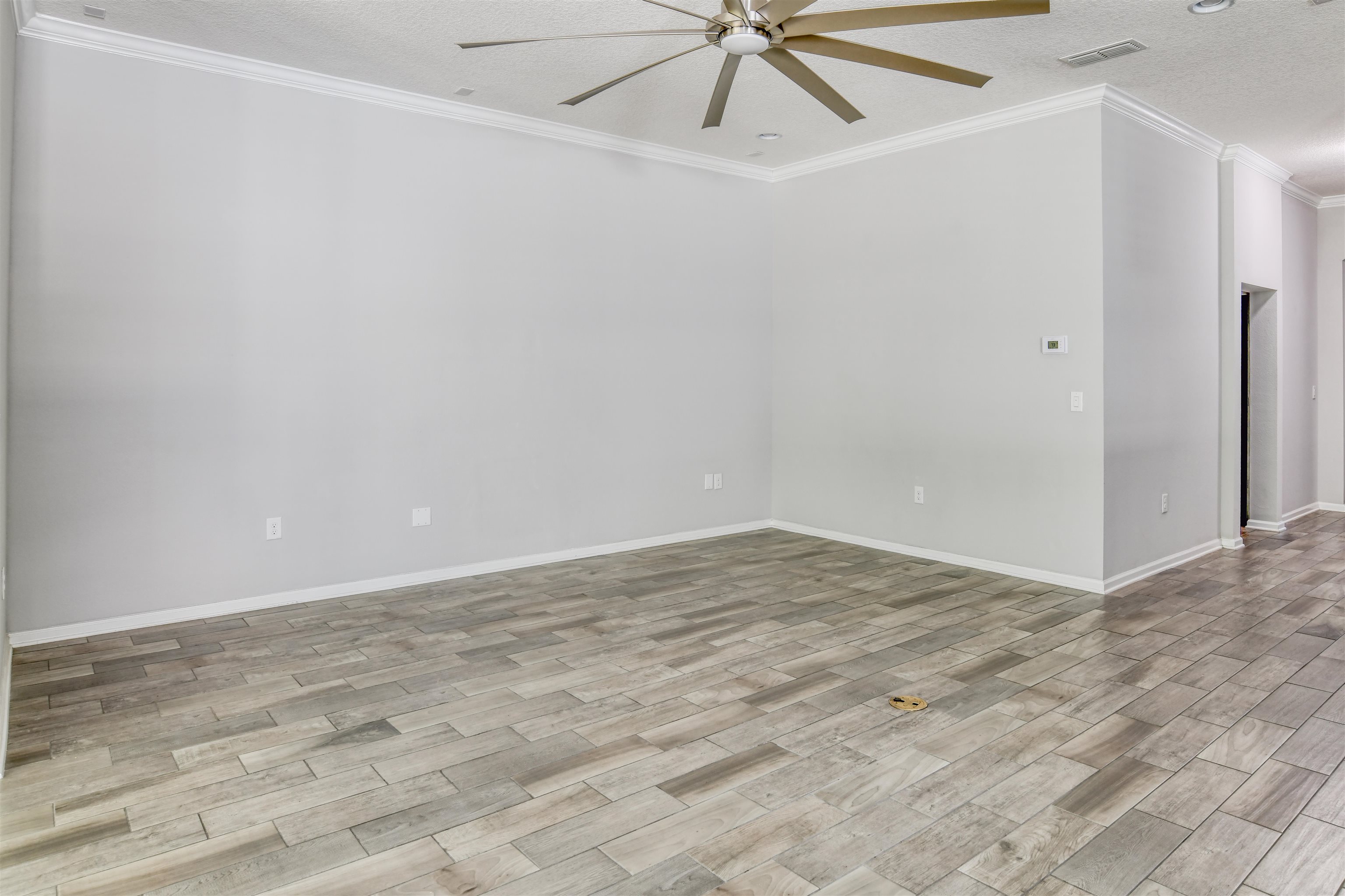 485 Crescent Key Drive St. Augustine, FL 32086 - Photo 13 of 46 a view of a room with wooden floor