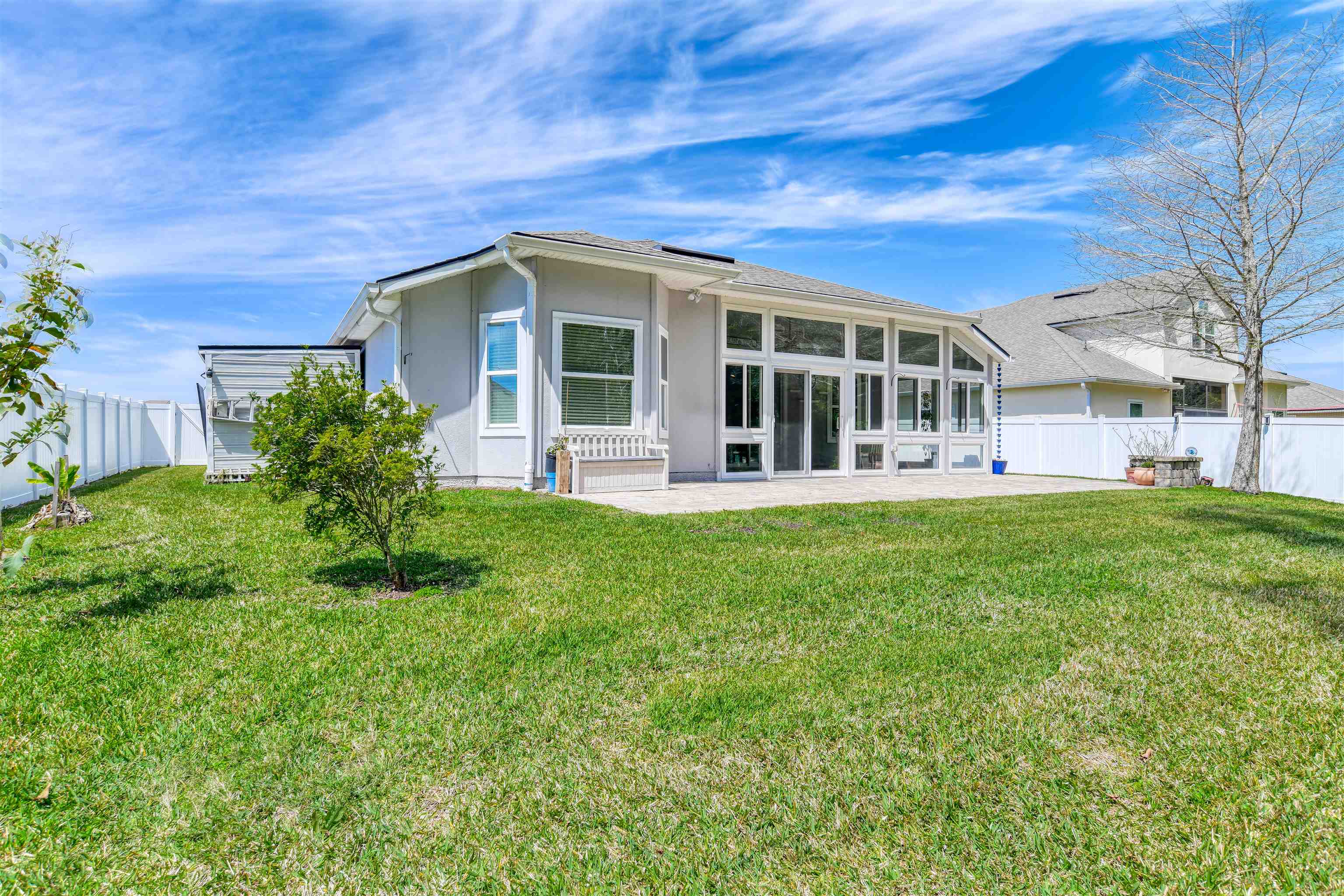 485 Crescent Key Drive St. Augustine, FL 32086 - Photo 16 of 46 a front view of house with yard and green space