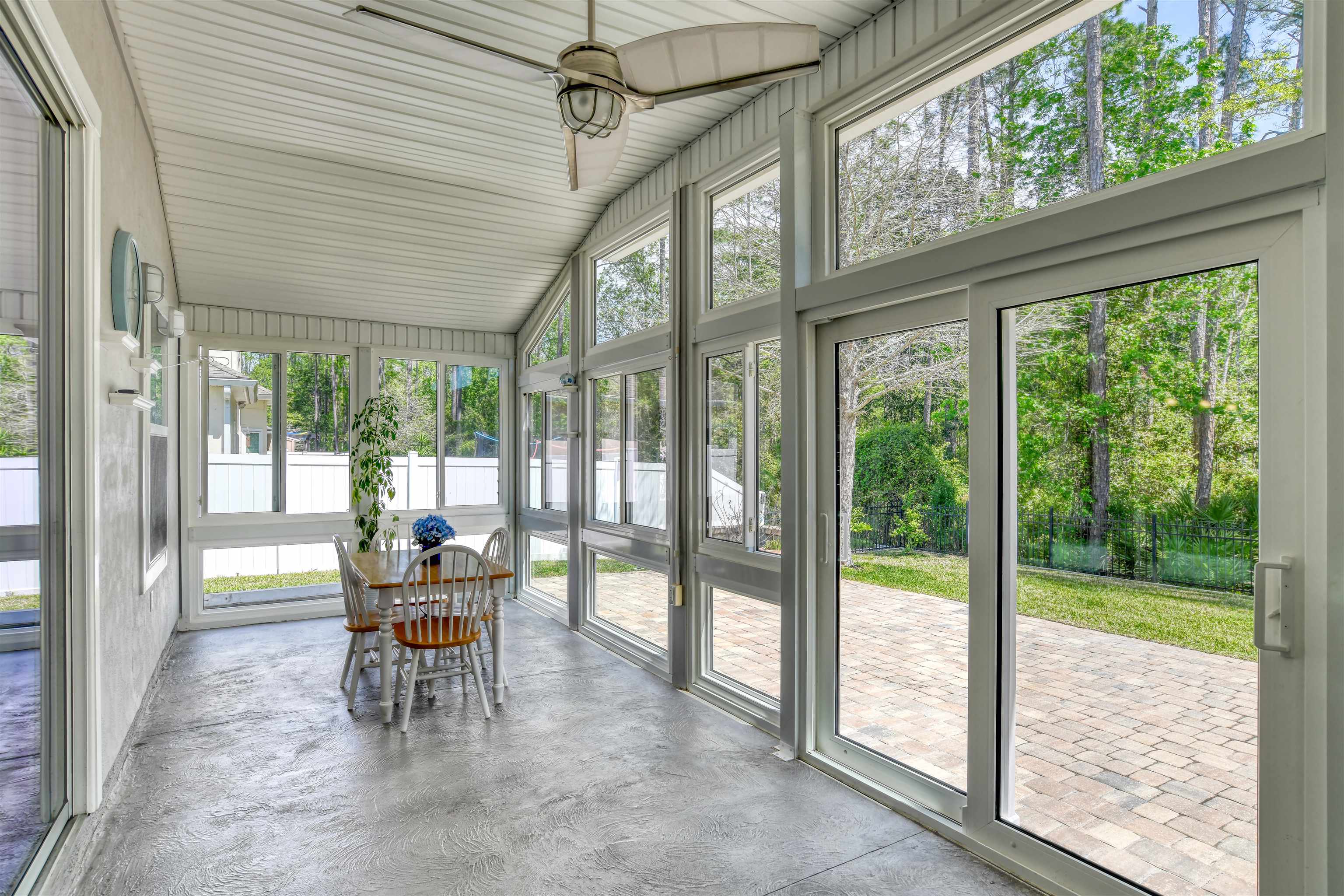 485 Crescent Key Drive St. Augustine, FL 32086 - Photo 18 of 46 a view of a porch with chairs and backyard