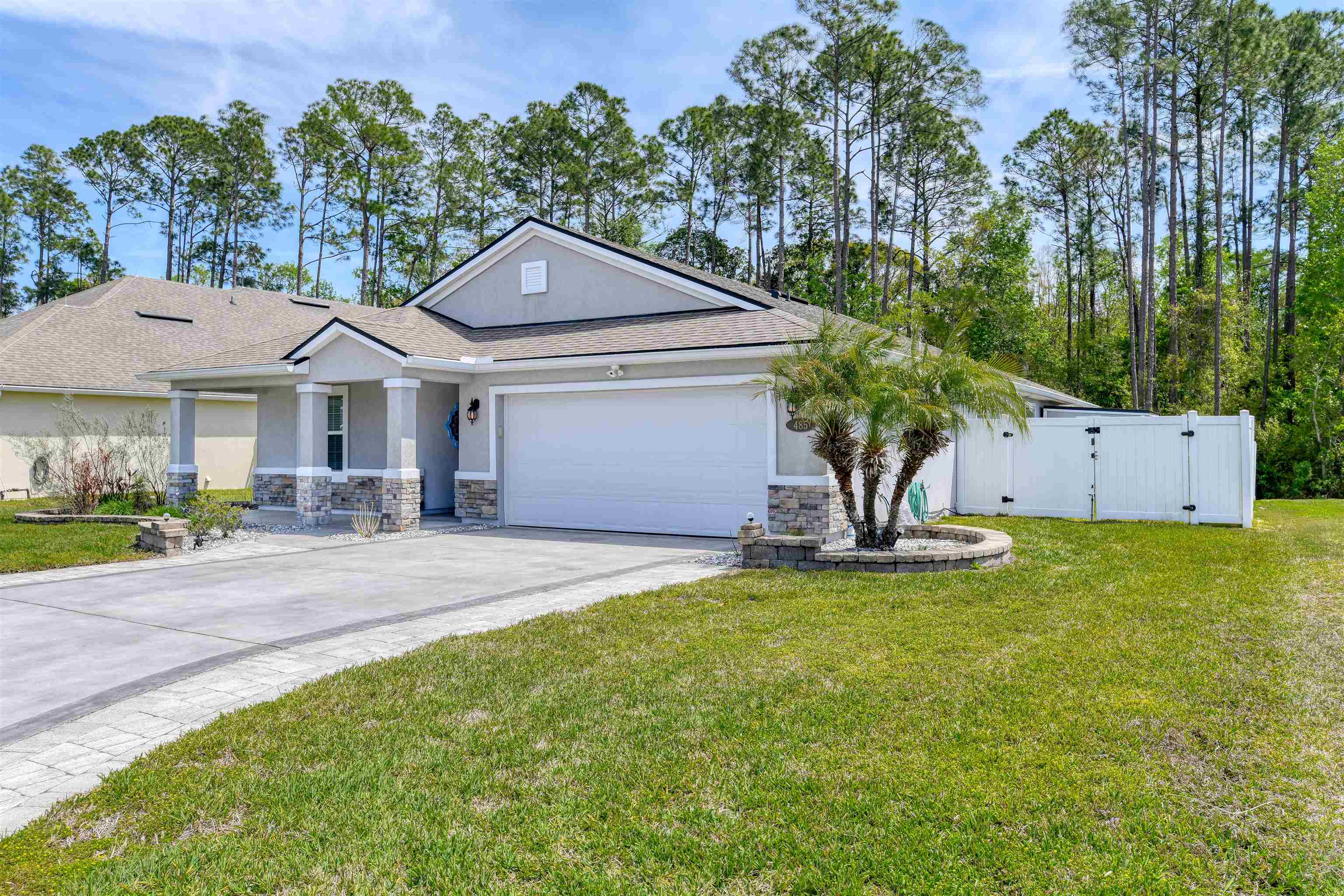 485 Crescent Key Drive St. Augustine, FL 32086 - Photo 3 of 46 a front view of a house with a yard