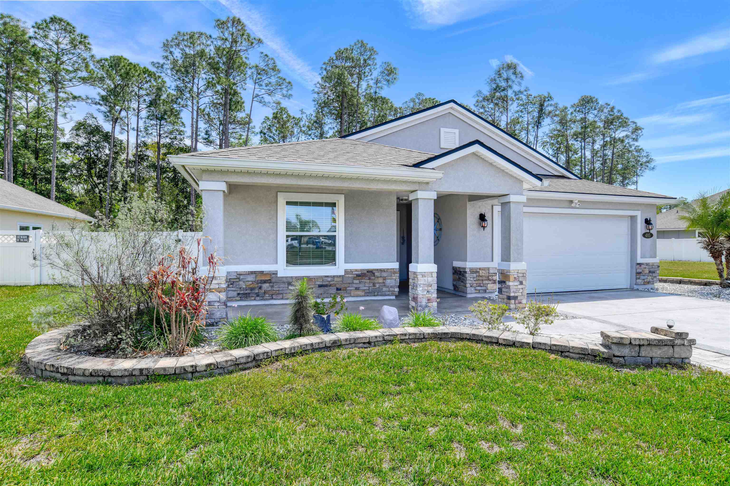 485 Crescent Key Drive St. Augustine, FL 32086 - Photo 5 of 46 a front view of house with a garden and patio