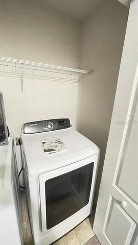 a utility room with dryer and washer