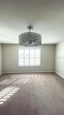a view of a livingroom and window