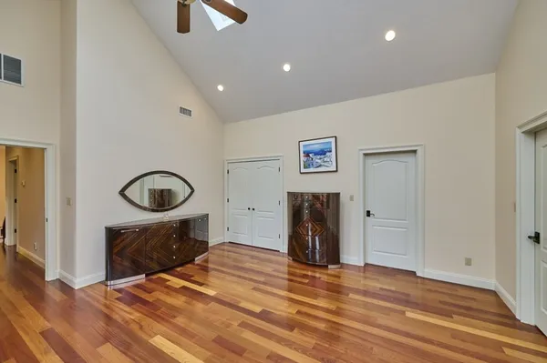 a bedroom with a bed and a mirror