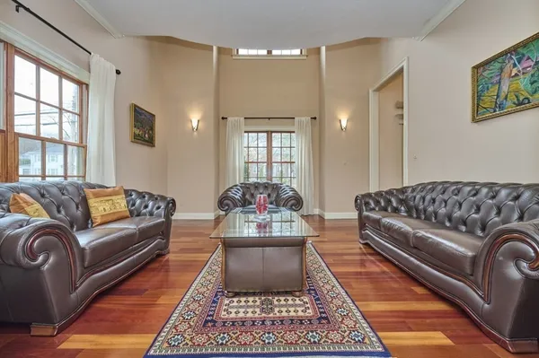 a living room with furniture and a rug