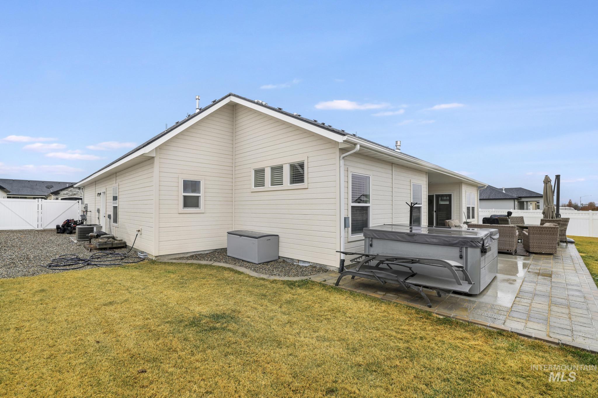 3103 Moonrise Road Twin Falls, ID 83301 - Photo 33 of 40 Rear view of property with a fenced backyard, a patio area, and a gate