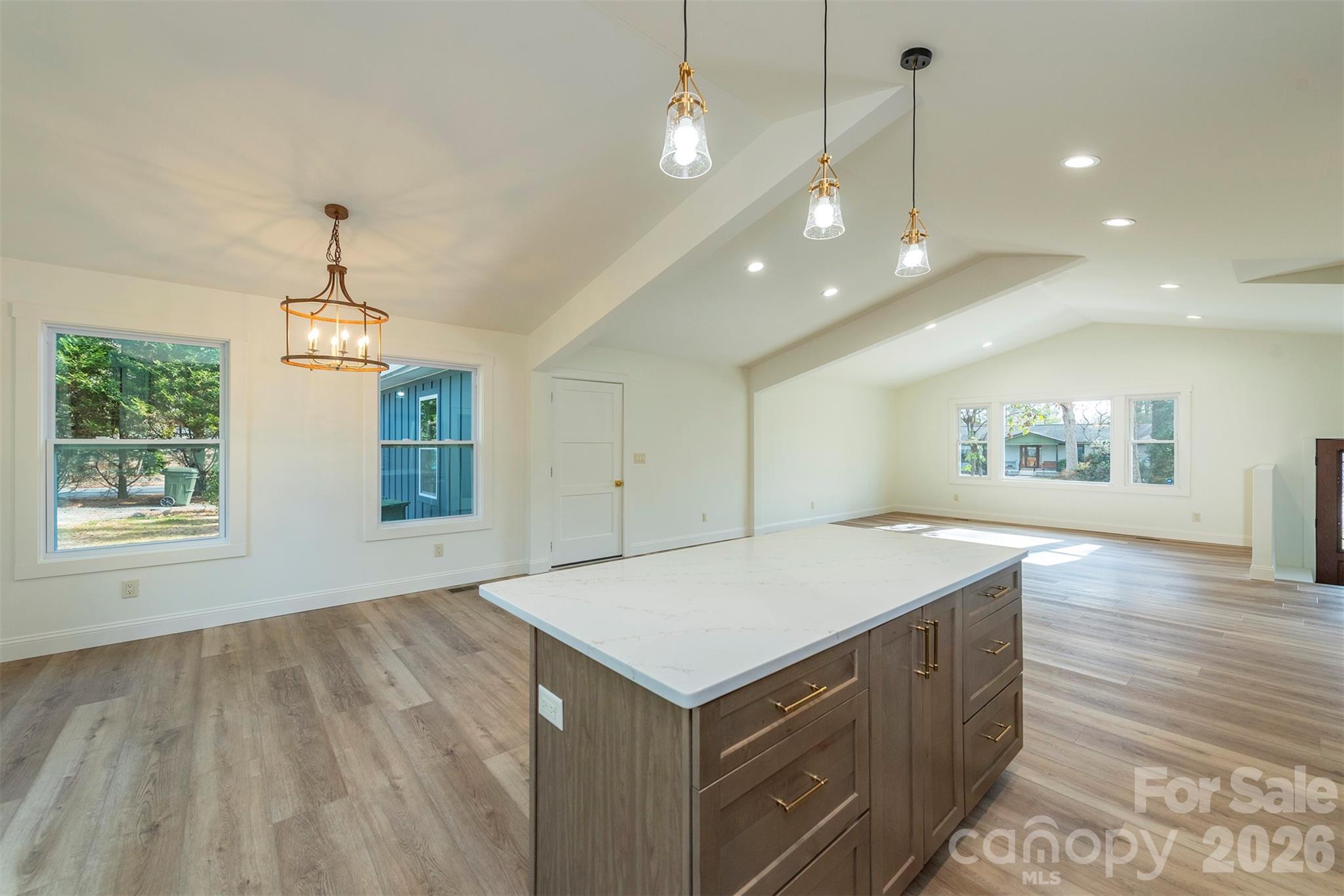 524 Pineland Road Hendersonville, NC 28792 - Photo 12 of 36 a kitchen with a stove and a wooden floors