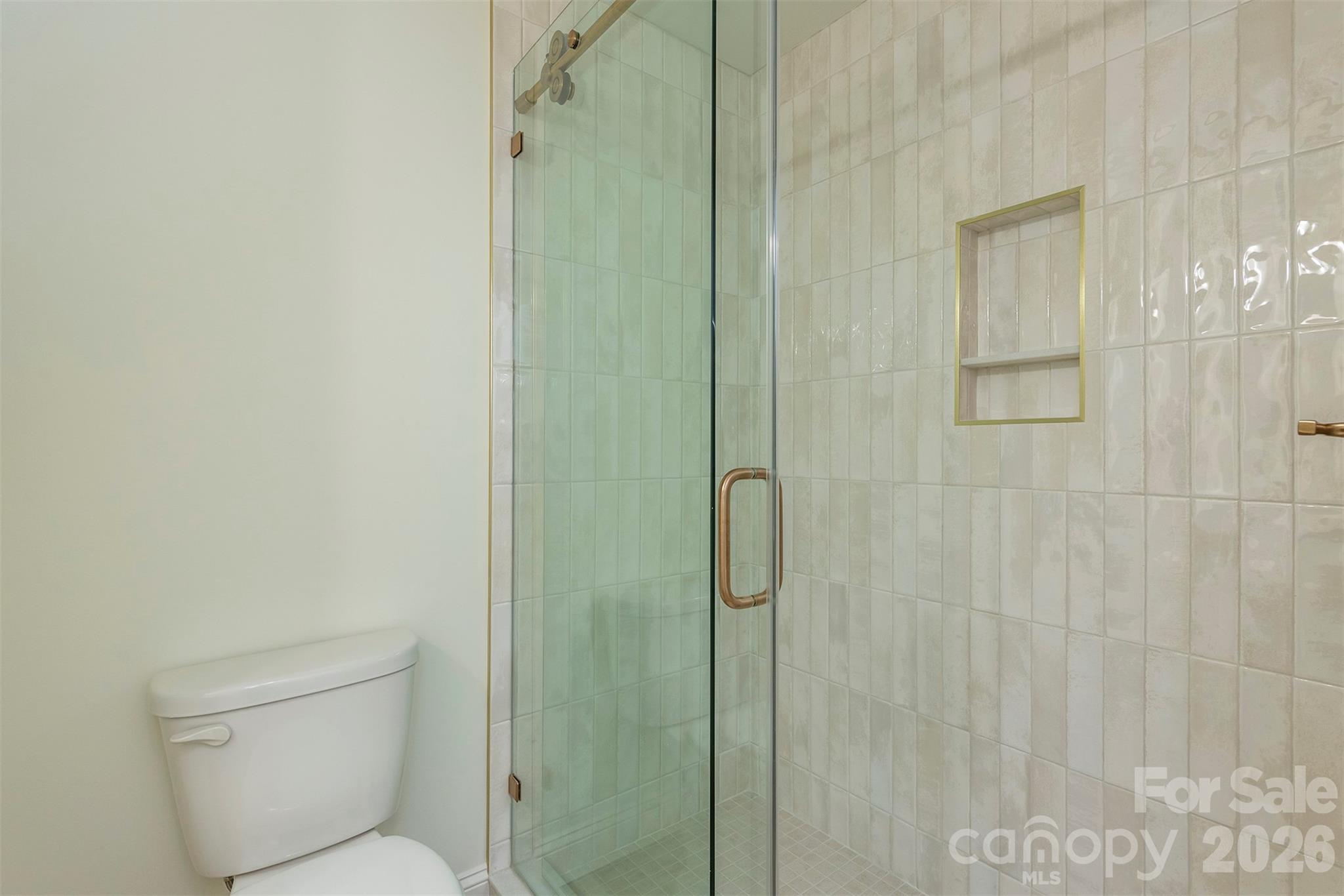 524 Pineland Road Hendersonville, NC 28792 - Photo 18 of 36 a bathroom with a toilet and shower