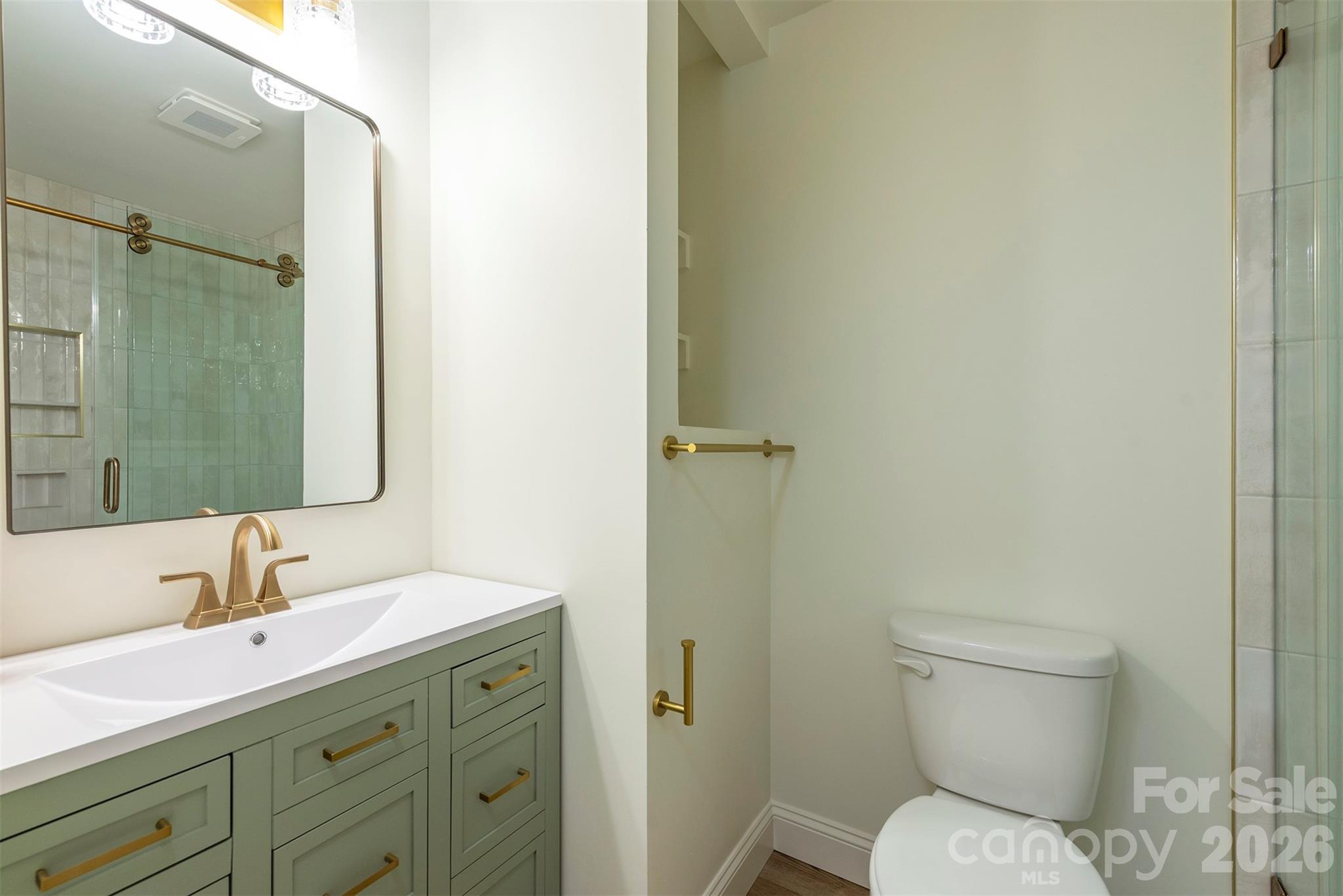 524 Pineland Road Hendersonville, NC 28792 - Photo 19 of 36 a bathroom with a sink toilet and shower