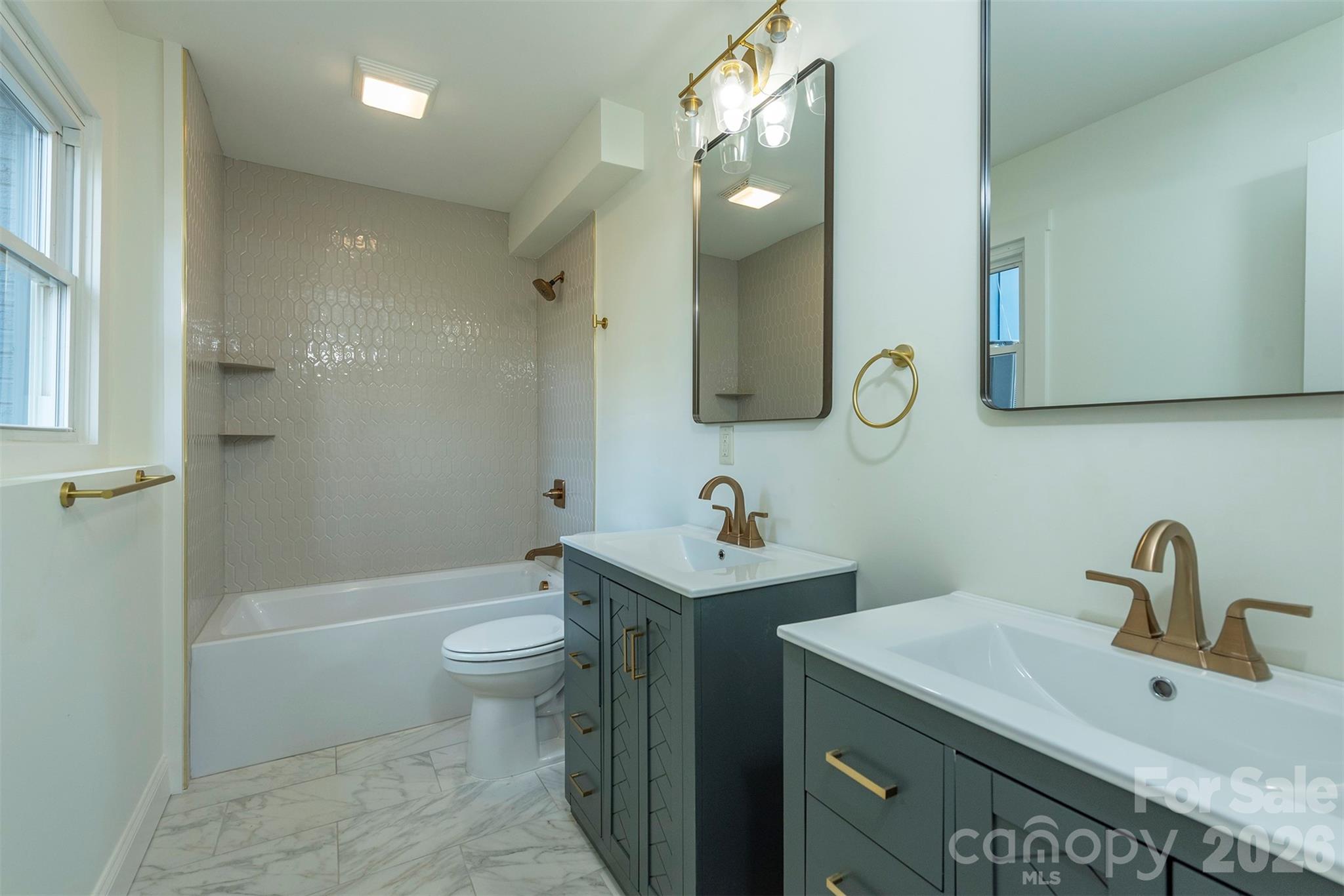 524 Pineland Road Hendersonville, NC 28792 - Photo 30 of 36 a bathroom with a sink a toilet and shower